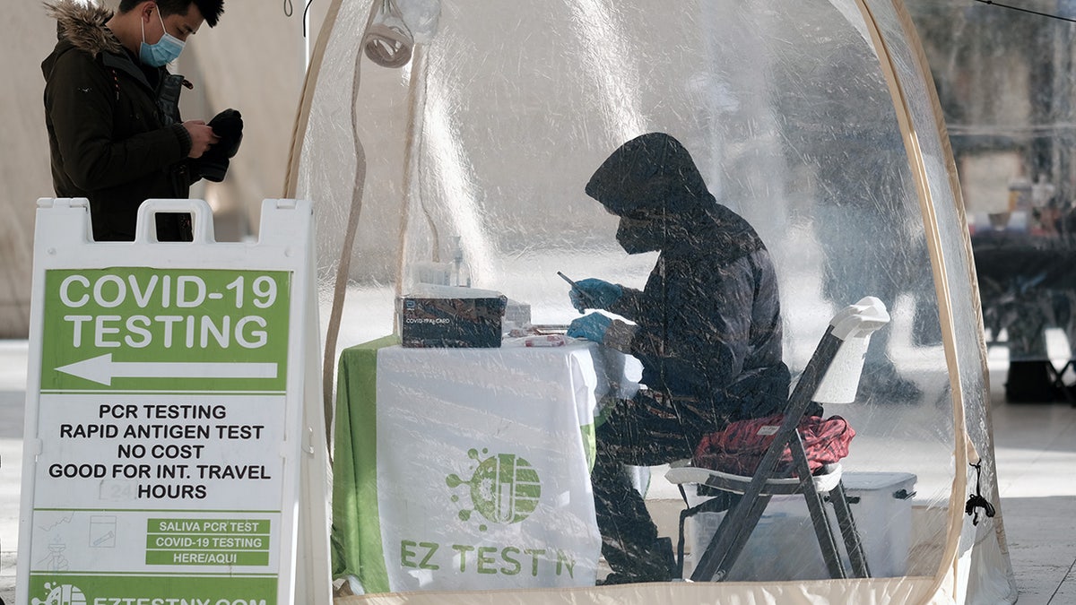 A person visiting a Covid-19 testing site on a Manhattan street in New York City