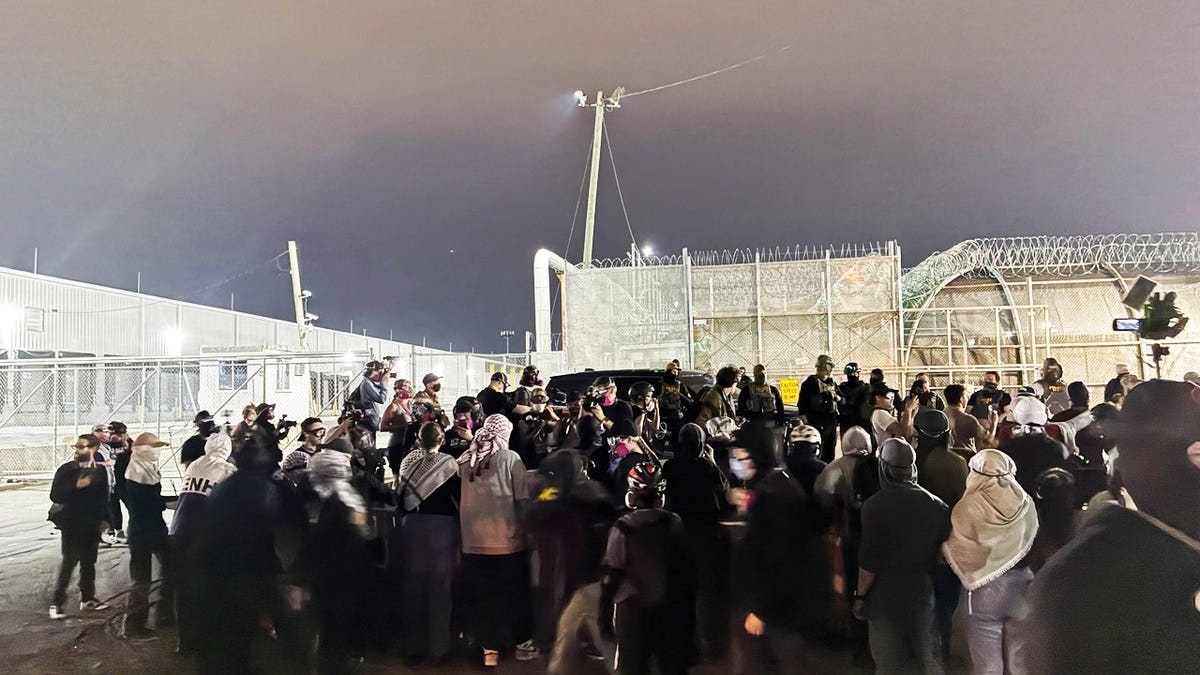 Protestors congregate outside Delaney Hall detention center