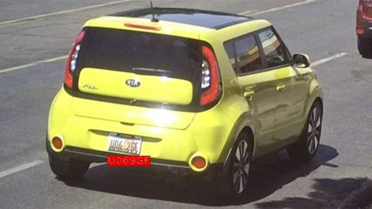 Yellow Kia Soul parked on a residential street