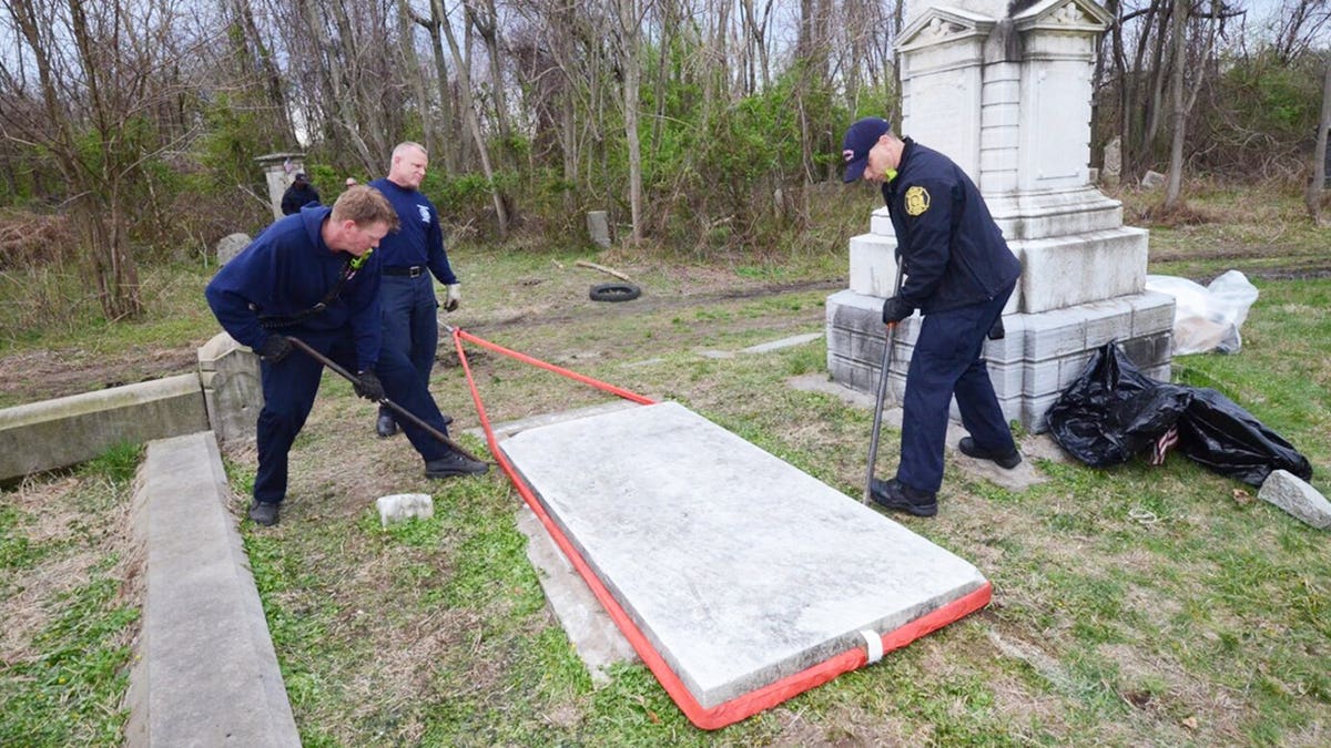 Police opening up a crypt at Mt. Moriah Cemetery.