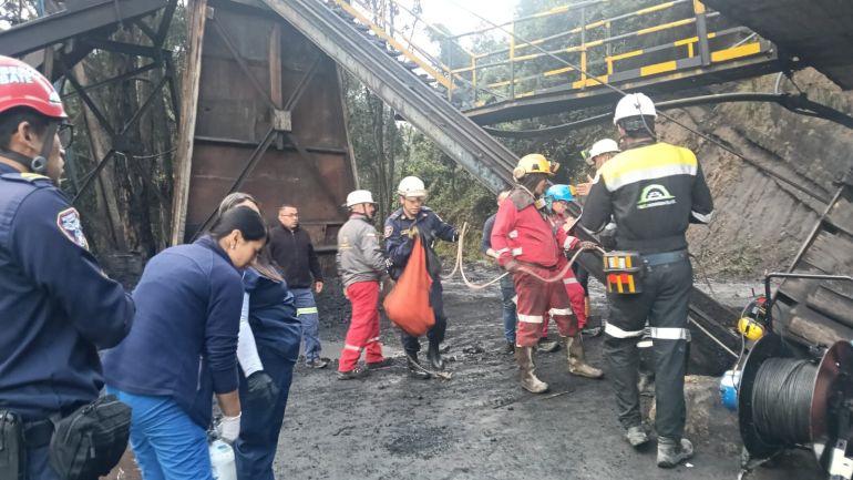 This handout picture released by the Cundinamarca Fire Department shows firefighters inspecting the site of an explosion at a coal mine in Sutatausa, Cundinamarca department, Colombia on May 4, 2026.