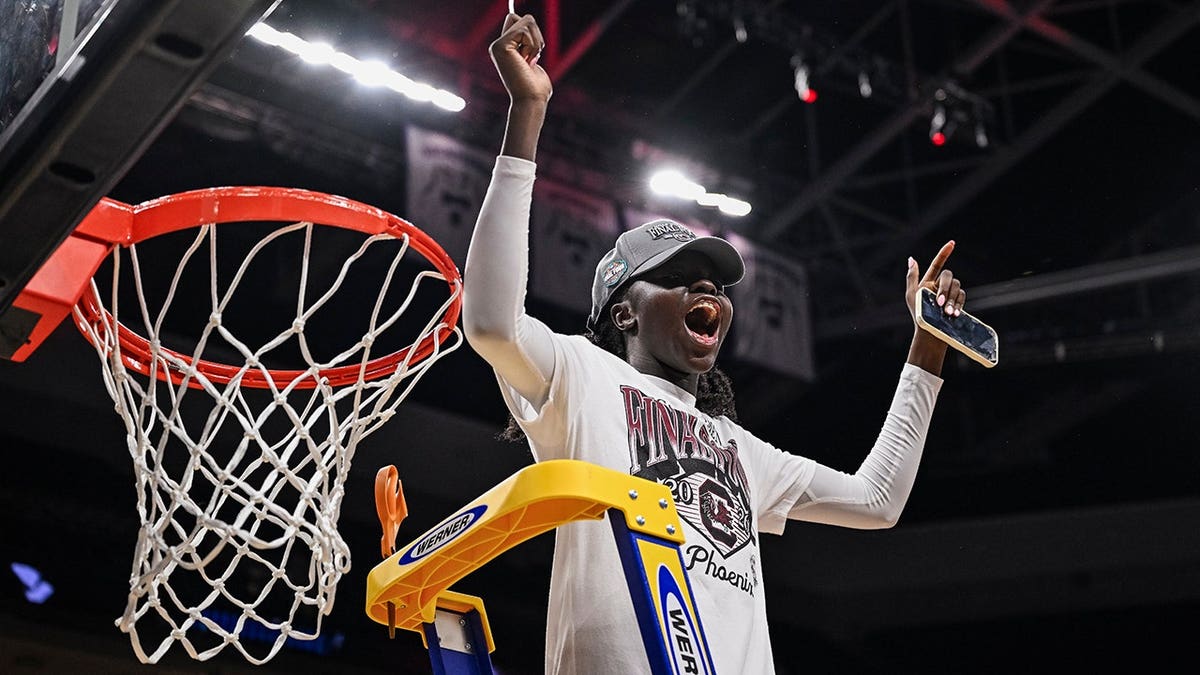 South Carolina guard Agot Makeer celebrating after cutting the net.