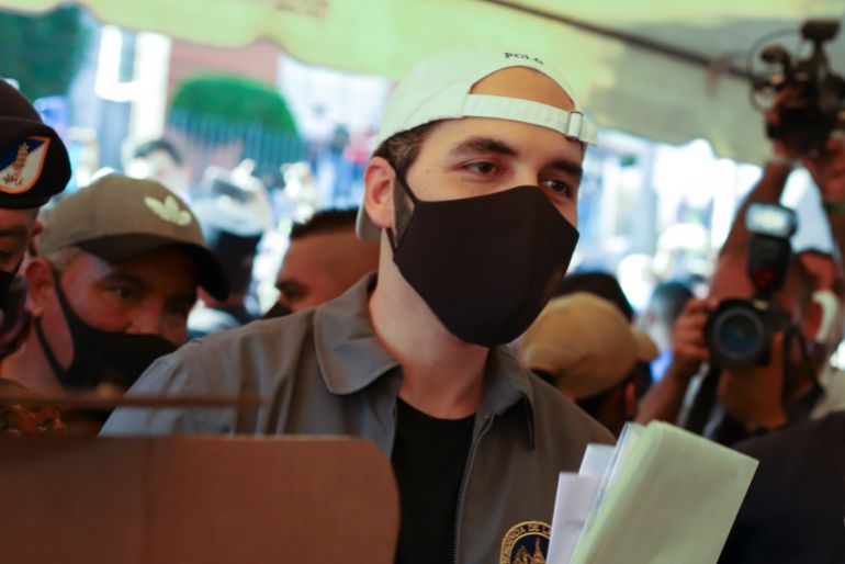 Nayib Bukele votes in San Salvador in 2021, amid strict pandemic controls introduced by his government.
