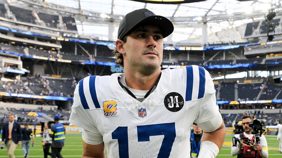 Indianapolis Colts quarterback Daniel Jones running off the field at SoFi Stadium