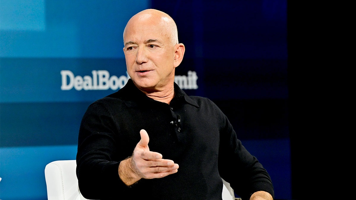 Billionaire Jeff Bezos standing at DealBook Summit