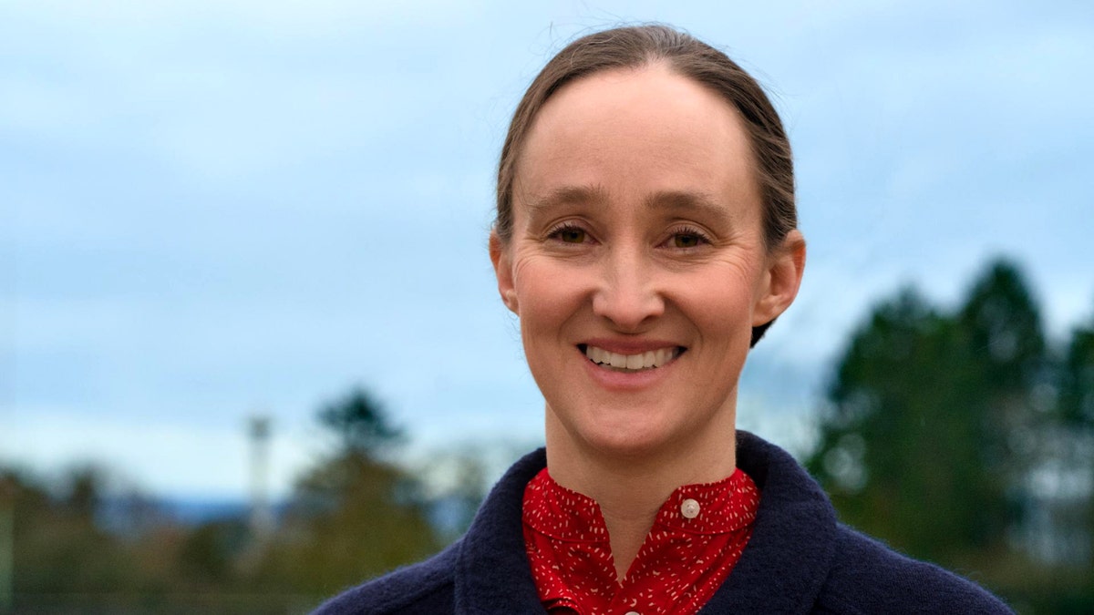 Seattle mayor Katie Wilson smiling in a portrait photograph