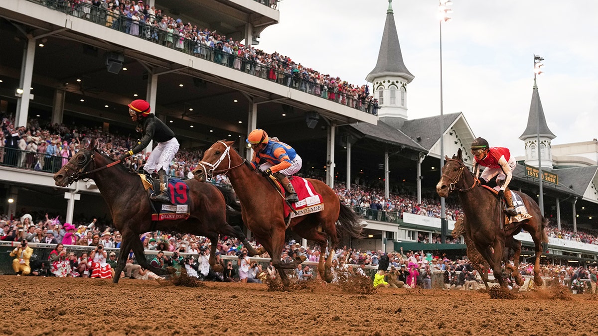 Jockey Jose L. Ortiz celebrating on Golden Tempo at Churchill Downs