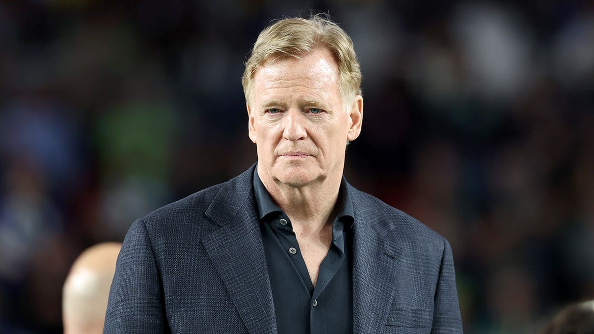 NFL Commissioner Roger Goodell standing with Vince Lombardi trophy at Levi's Stadium