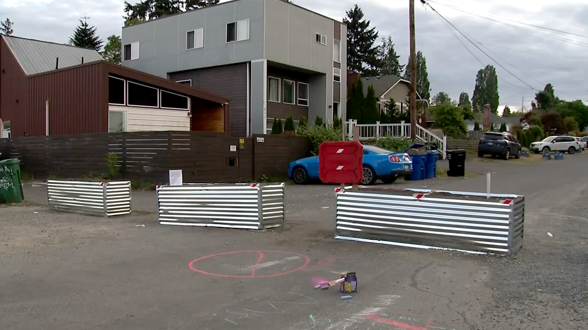 Makeshift barricades block a residential street near Seattle’s Aurora Avenue following multiple shootings and ongoing crime concerns