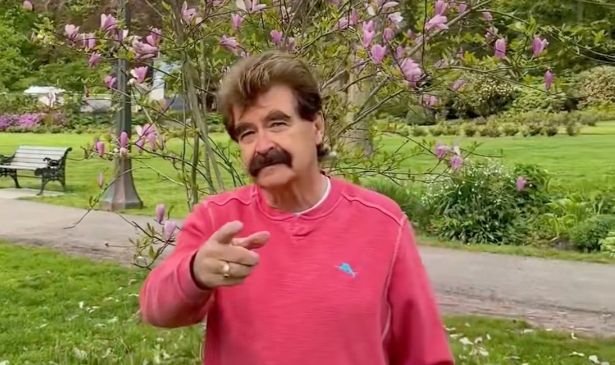 A man stands in a park.