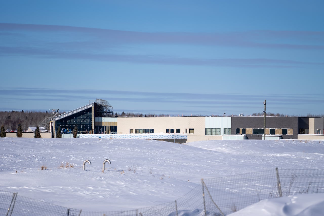 A building under construction is seen during the wintertime.