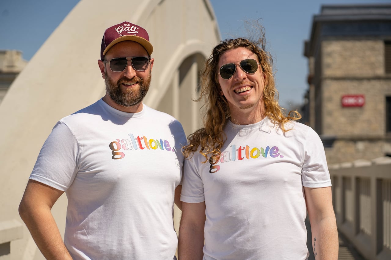 Portrait of Bryan Causarano and Eric Bolton with shirts that read, "galtlove."
