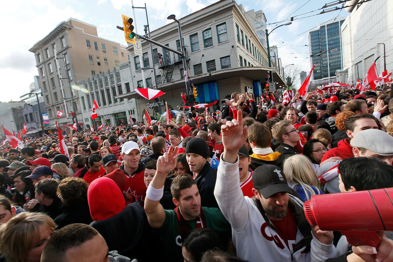 Crowds of people on the street in downtown Vancouver.