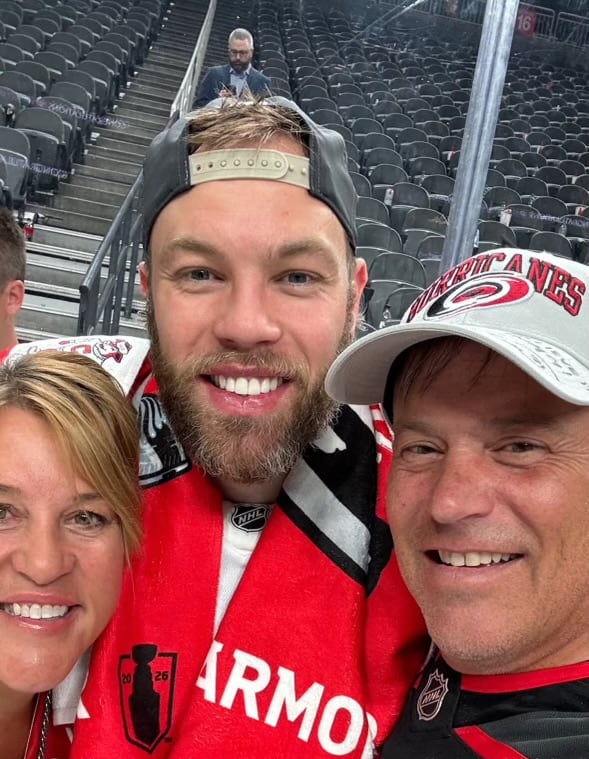 three people in jerseys.