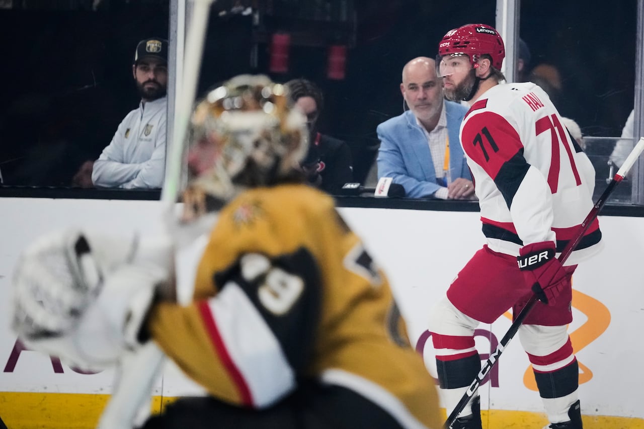 Carolina Hurricanes left wing Taylor Hall, right, skates away from the goal after scoring during the first period in Game 6 of the NHL hockey Stanley Cup Final series against the Vegas Golden Knights, Sunday, June 14, 2026, in Las Vegas, Nev.