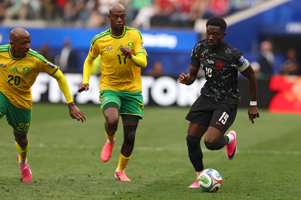A soccer player controls the ball.