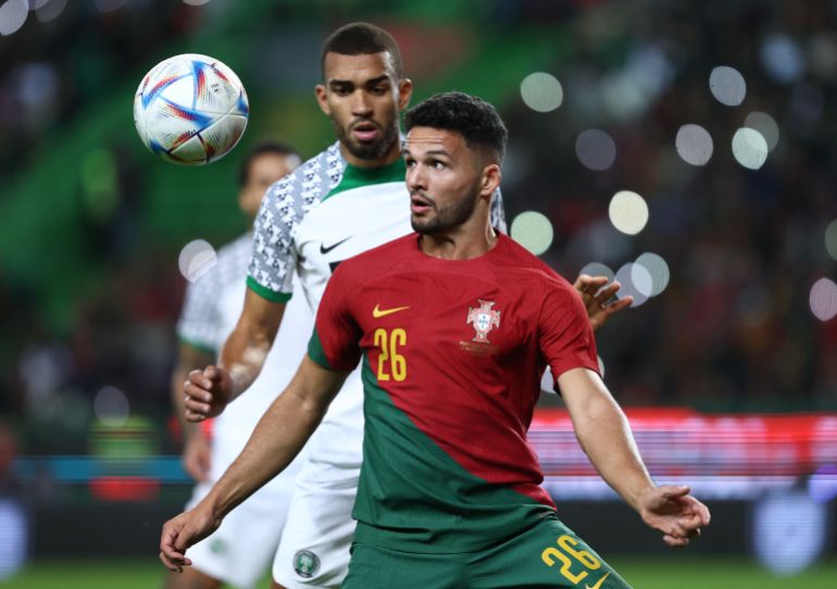 Portugal's Goncalo Ramos in action with Nigeria's Kevin Akpoguma. 