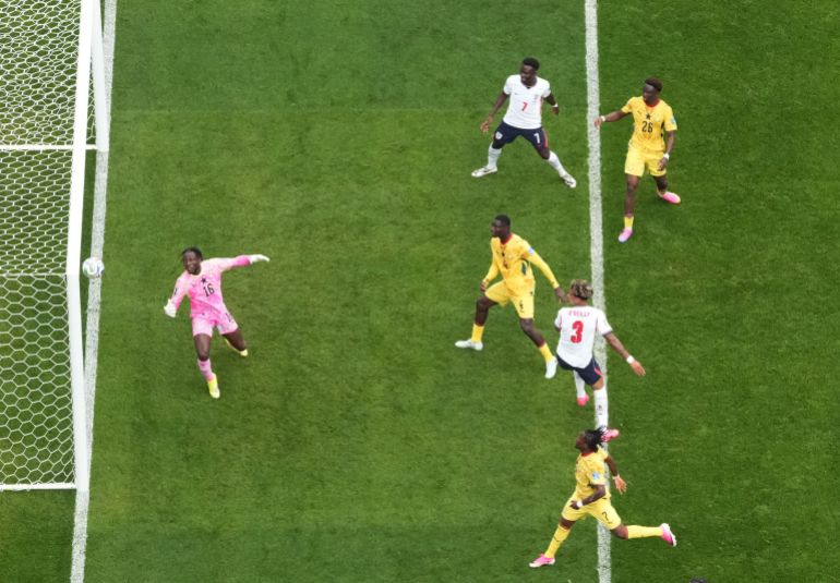England's Nico O'Reilly hits the crossbar with a header