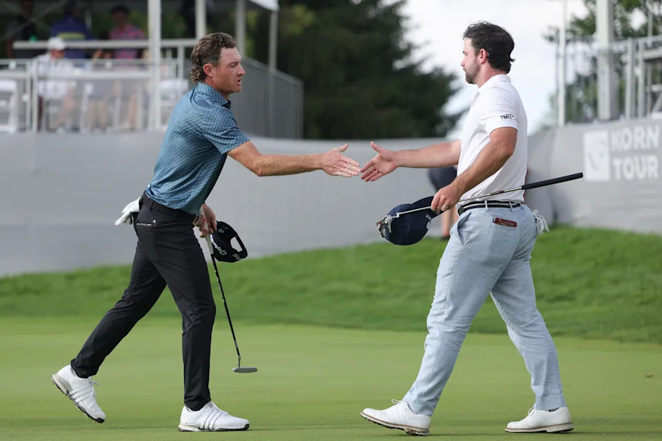 Drew Nesbitt of Canada greets Will Cannon of the United States after finishing on the 18th green during the third round of the Memorial Health Championship presented by LRS at Panther Creek Country Club on June 27, 2026 in Springfield, Illinois.