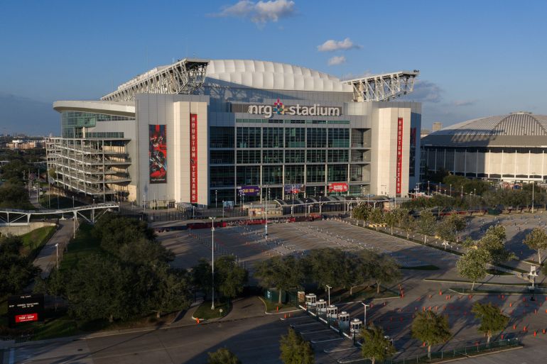 An aerial view of the NRG Stadium, one of the stadiums that will host 2026 FIFA World Cup matches, in Houston, Dec. 28, 2025. The Astrodome is pictured on right. (AP Photo/Jon Shapley)