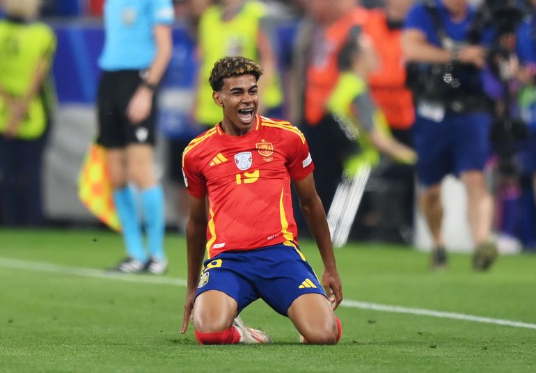 Footballer celebrates goal.