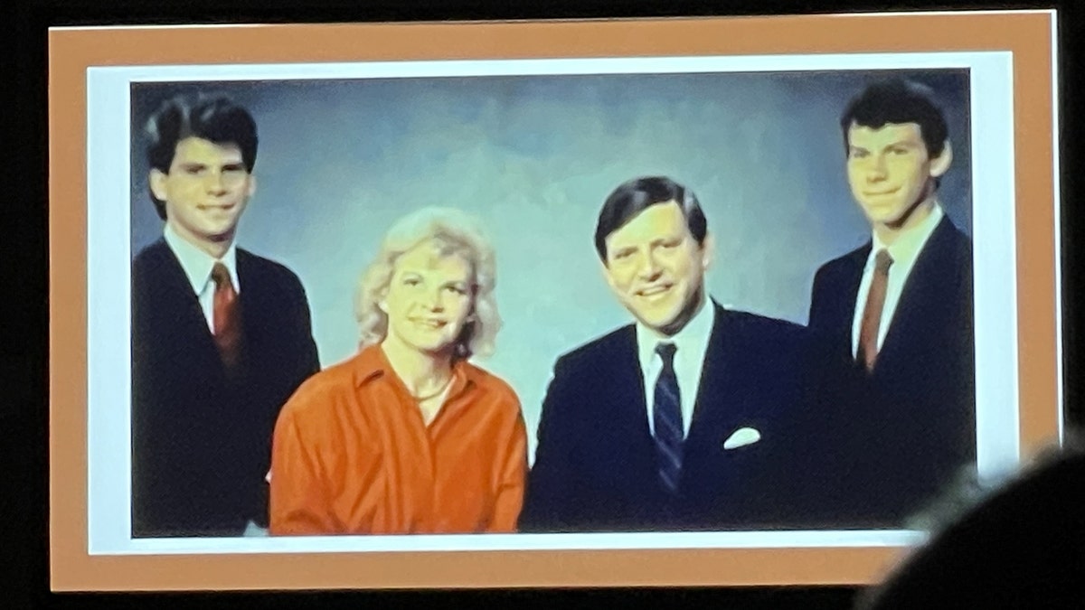 Menendez family photo displayed on screen during CrimeCon panel in Nashville Tennessee