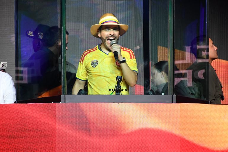 Colombia's presidential candidate Abelardo de la Espriella, of the Defensores de la Patria party, speaks behind bulletproof glass during his closing campaign rally in Medellin, Colombia on May 24, 2026.