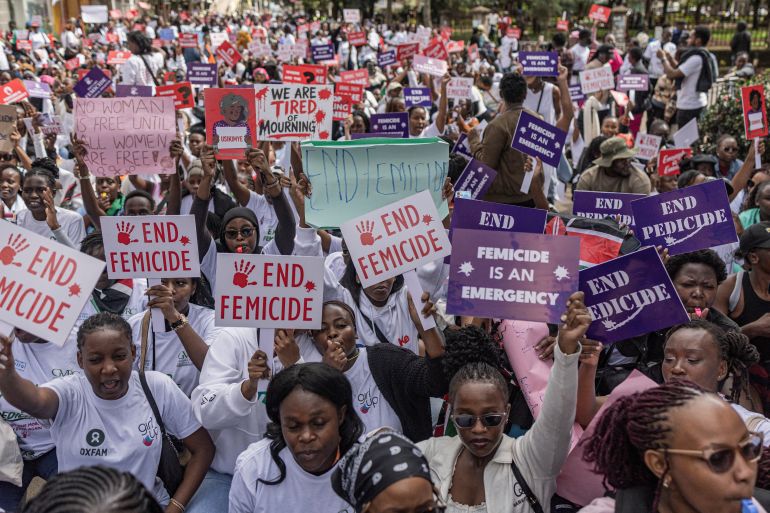 Kenyan women and activists hold placards during a protest against femicide, in Nairobi on June 1, 2026.