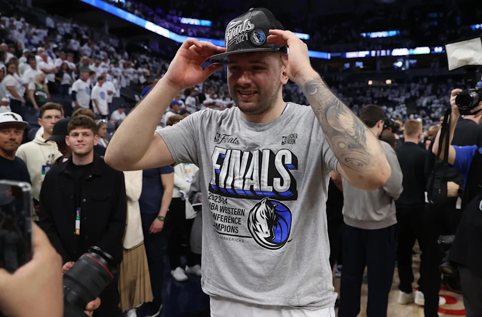 May 30, 2024; Minneapolis, Minnesota, USA; Dallas Mavericks guard Luka Doncic (77) celebrates after winning the Western Confrerence Championship against the Minnesota Timberwolves in game five of the western conference finals for the 2024 NBA playoffs at Target Center. Mandatory Credit: Jesse Johnson-USA TODAY Sports