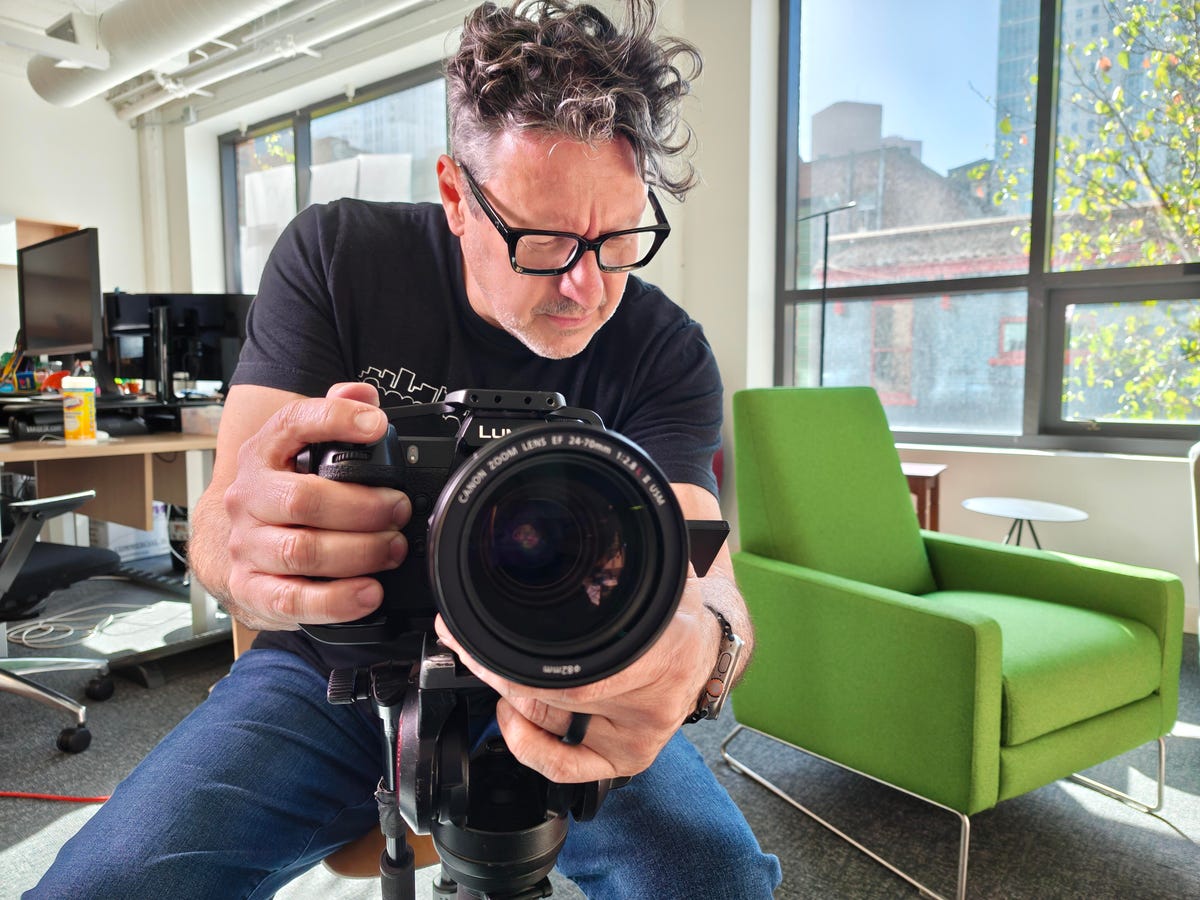 A man taking a photo with a camera