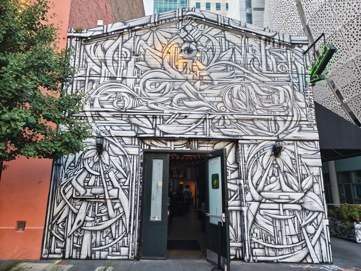 A white building with black doodles all over it