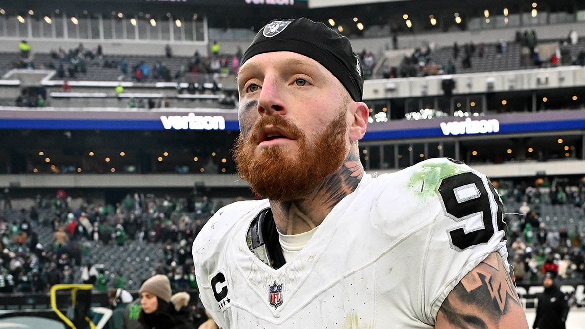 Las Vegas Raiders defensive end Maxx Crosby standing on the field at Lincoln Financial Field