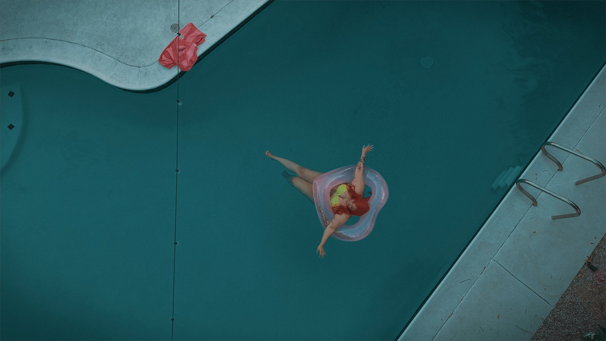 A woman floats in a swimming pool at the Pearadise house in Las Vegas