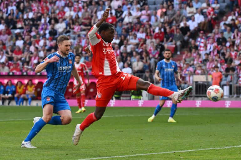 Soccer Football - Bundesliga - Bayern Munich v 1. FC Heidenheim - Allianz Arena, Munich, Germany - May 2, 2026 Bayern Munich's Nicolas Jackson in action with 1. FC Heidenheim's Patrick Mainka REUTERS/Angelika Warmuth DFL REGULATIONS PROHIBIT ANY USE OF PHOTOGRAPHS AS IMAGE SEQUENCES AND/OR QUASI-VIDEO.