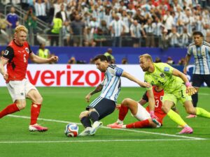 Messi grabs brace to make World Cup history and send Argentina into last 32
