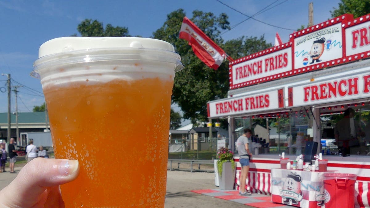 Orange dirty soda cup on a table at the Ross County Fair