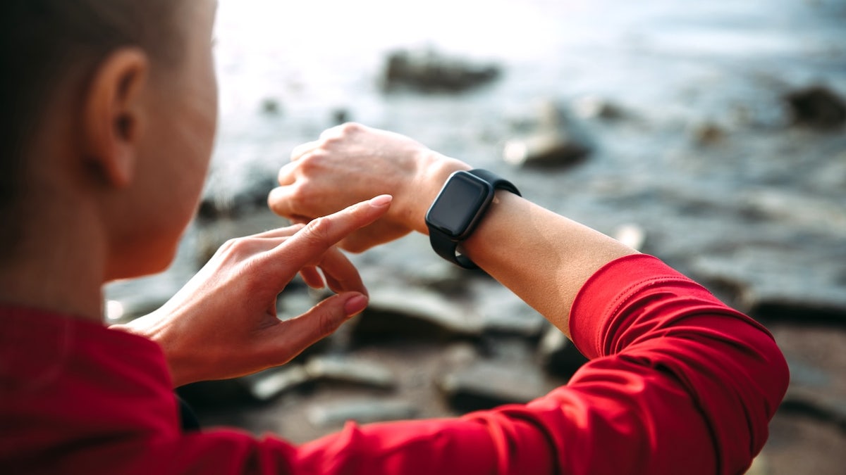 Woman working out with smartwatch