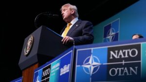 Trump tempers fury to end two-day NATO summit on high note