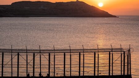 Hundreds of migrants swim from Morocco to Spanish territory