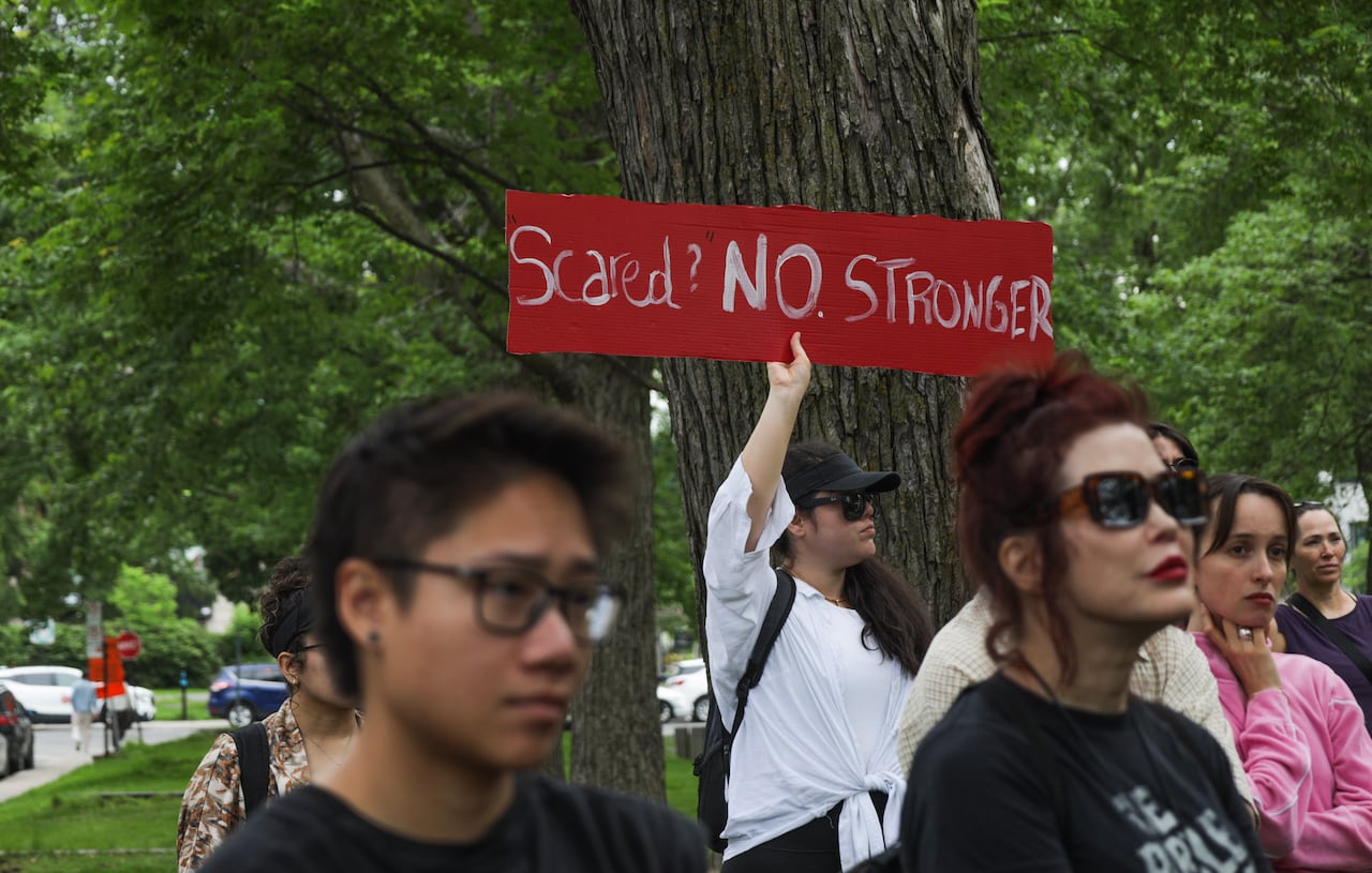 People holding up signs.