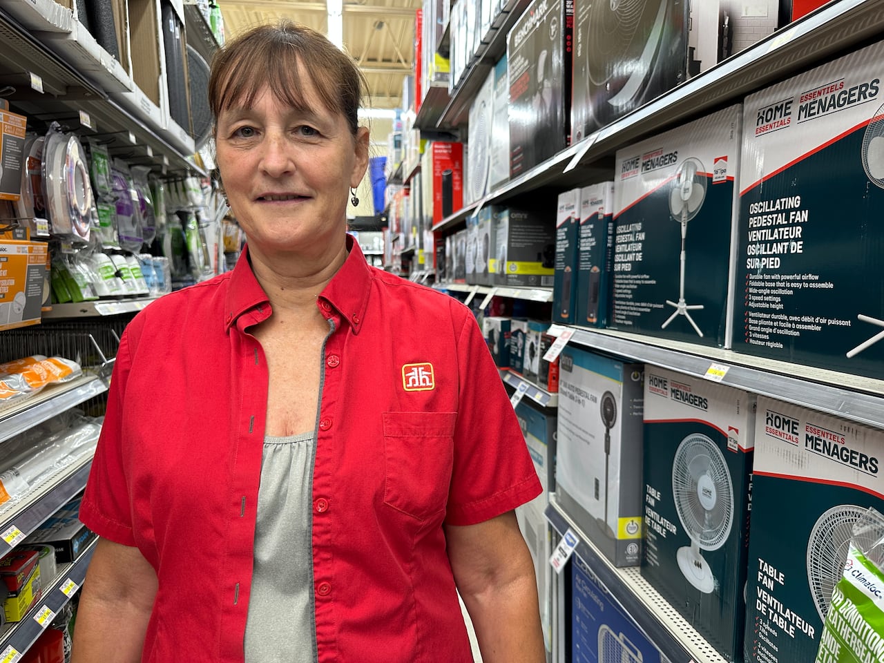 A woman standing in an aisle.