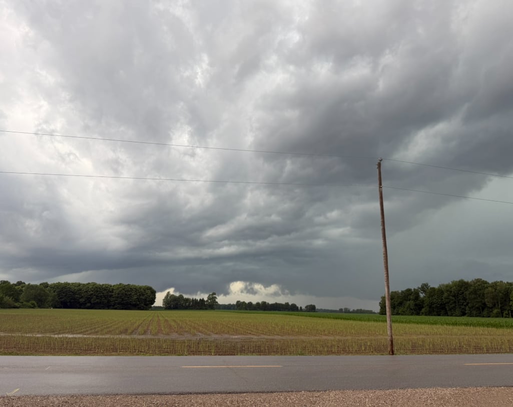 Dark clouds over a farm