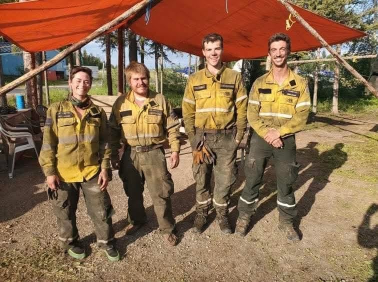 4 people in wildfire fighting uniforms
