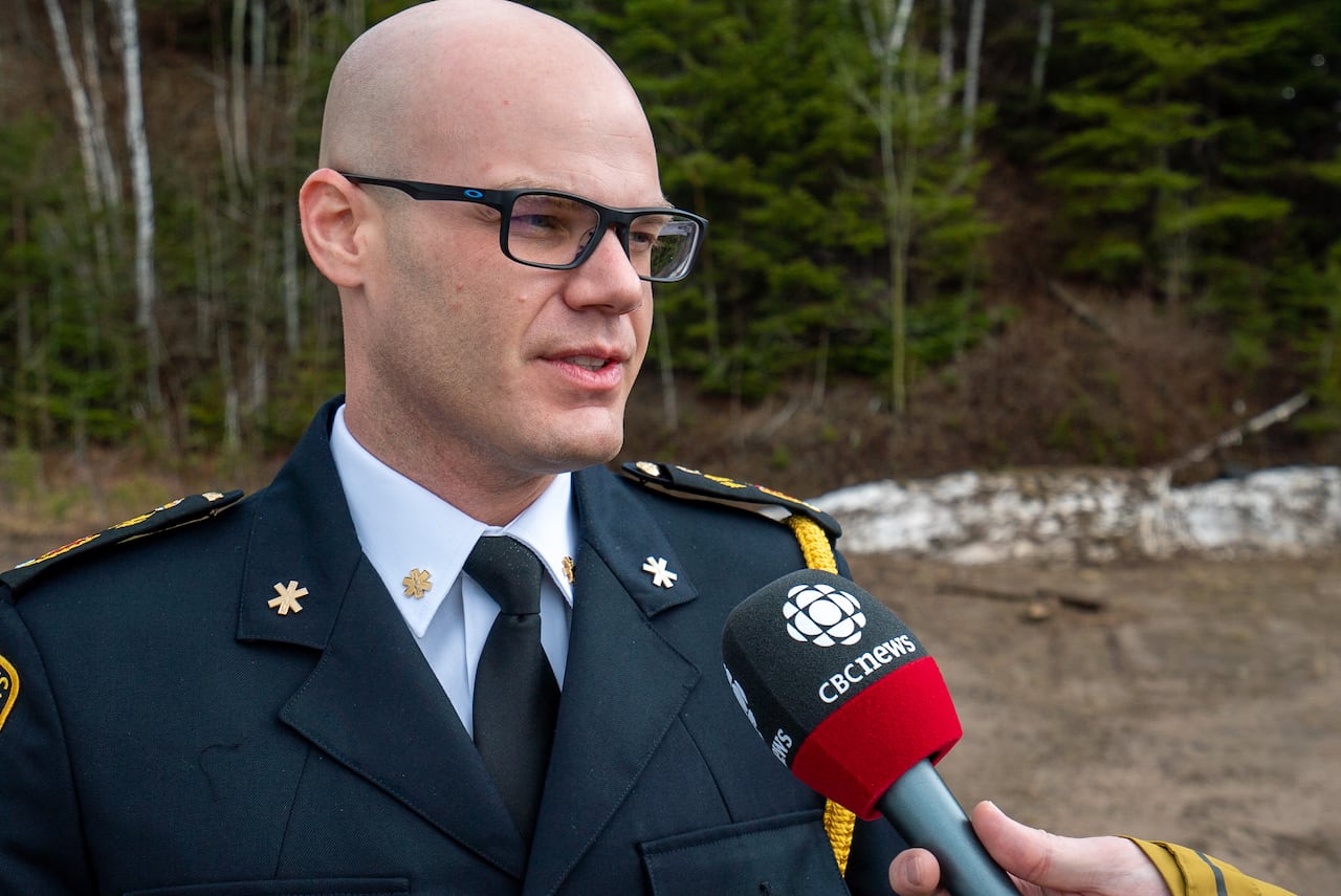 A man speaks into a microphone.