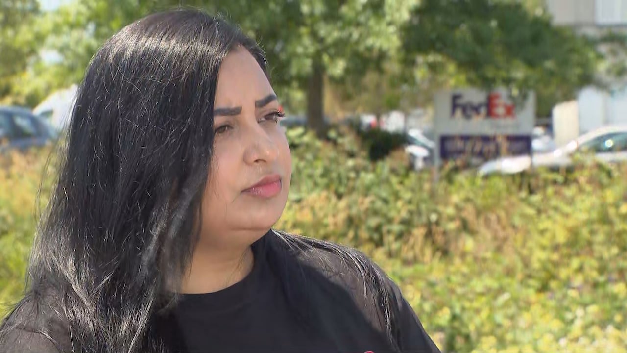 A woman with long black hair.