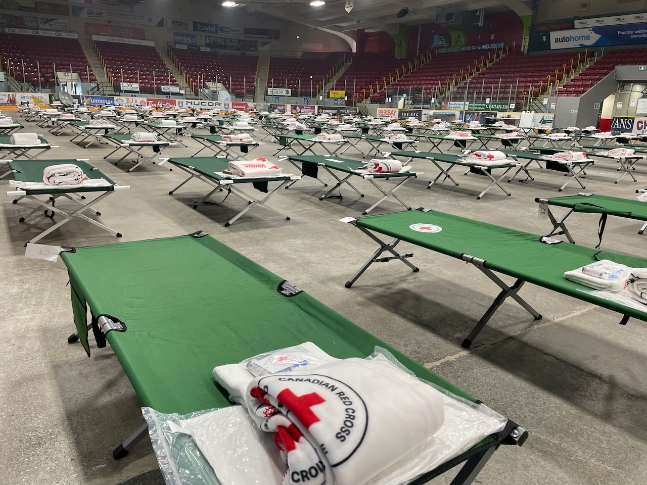 green beds with white towels