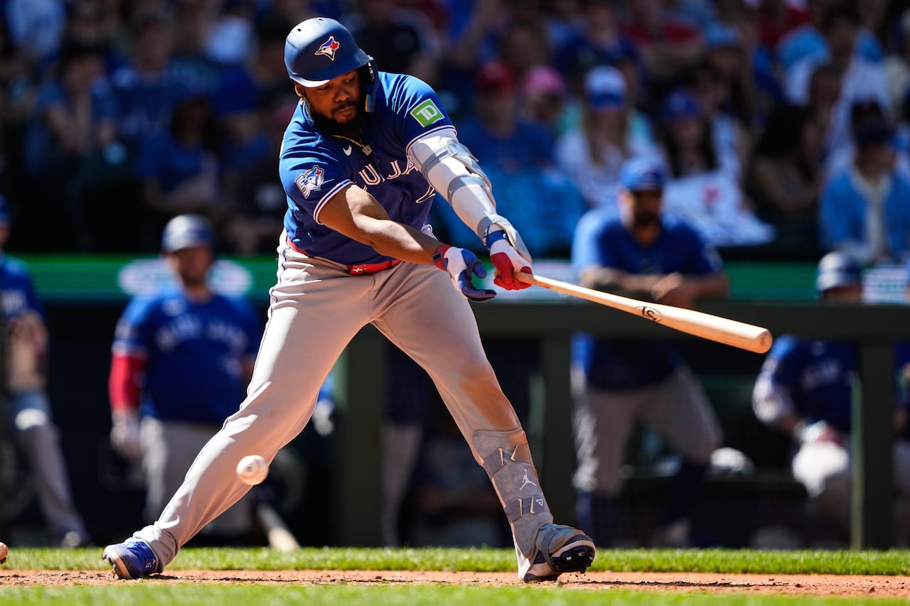 Blue Jays Vlad Guerrero Jr swings and misses at a pitch on a sunny day in Seattle
