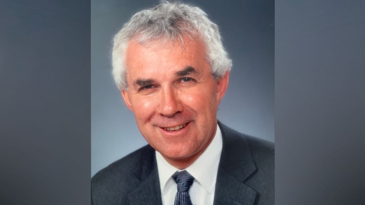 A man's headshot is shown.