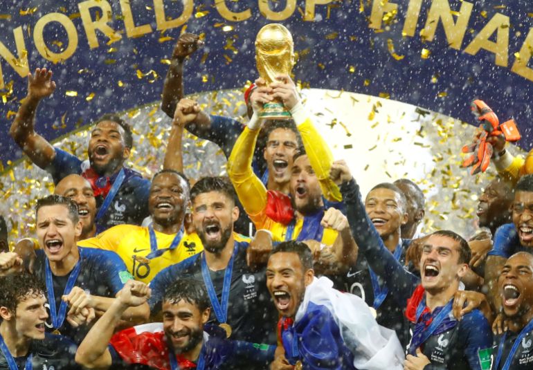 FranceÕs Hugo Lloris lifts the trophy as they celebrate after winning the World Cup