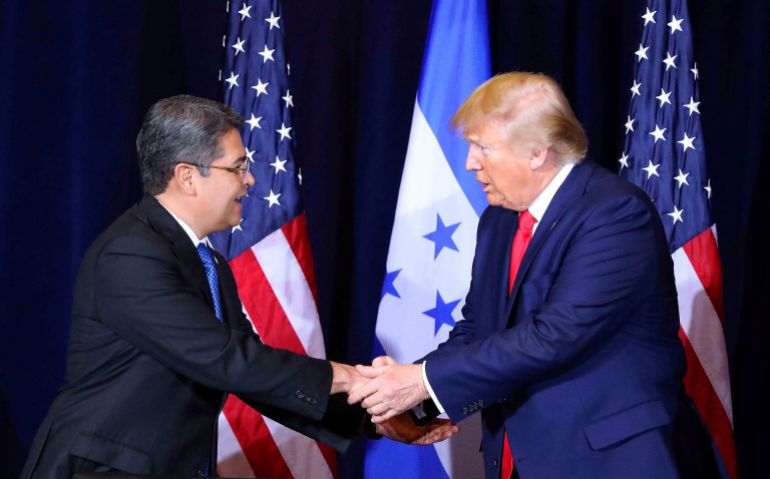 Hernandez shakes hands with US President Donald Trump on September 25, 2019, in New York during the signing of an agreement under which Honduras would accept more asylum seekers heading to the US